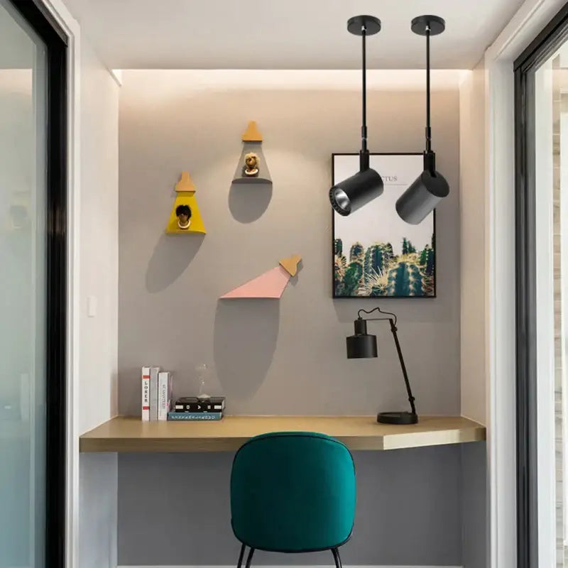 Teal velvet chair with black metal legs beside DecorBites™ modern aluminium telescopic wall lamps for gallery lighting
