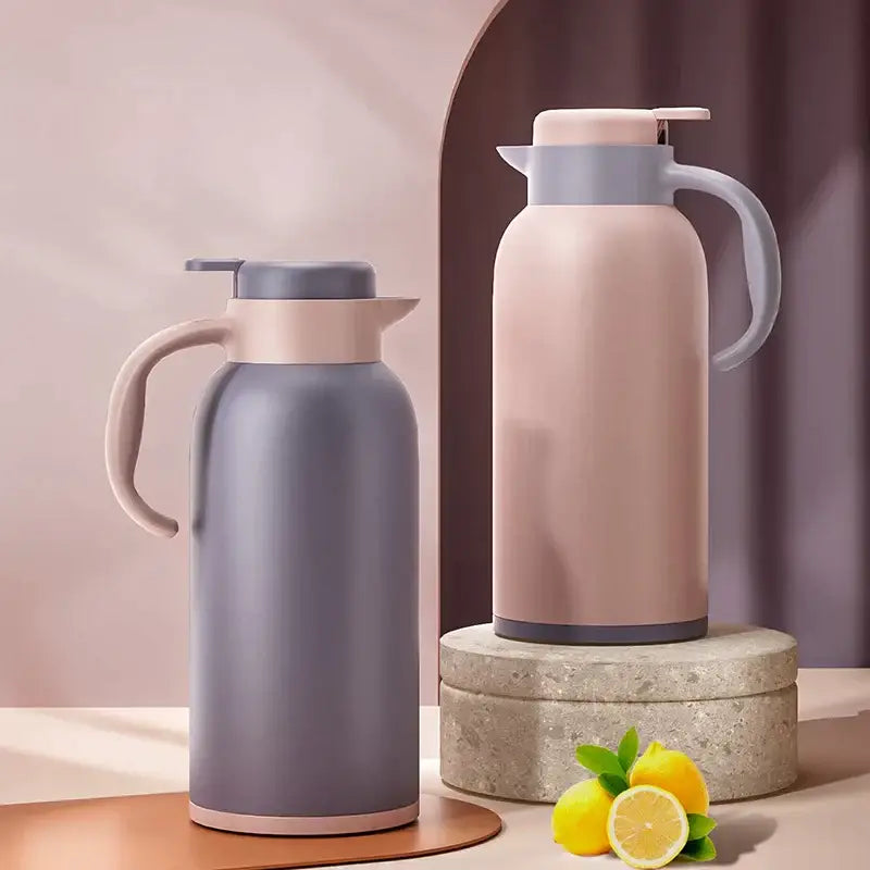 Two matte insulated thermo bottles in gray and blush pink with led temperature display and light handles and lids