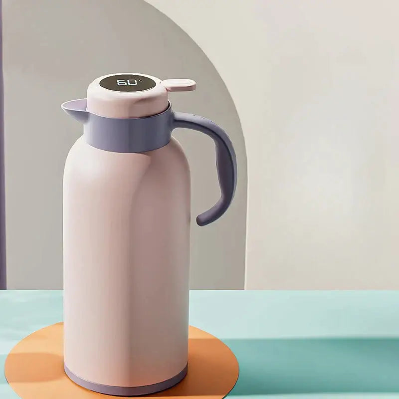 Pastel pink DecorBites thermo bottle with gray handle and led temperature display showing 60°c for hot drinks