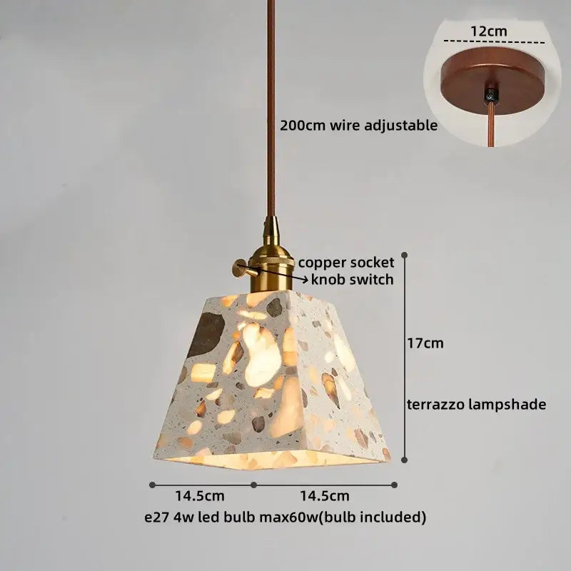 A decorbites led terrazzo pendant light with a speckled gray beige and brown terrazzo lampshade on adjustable copper wire