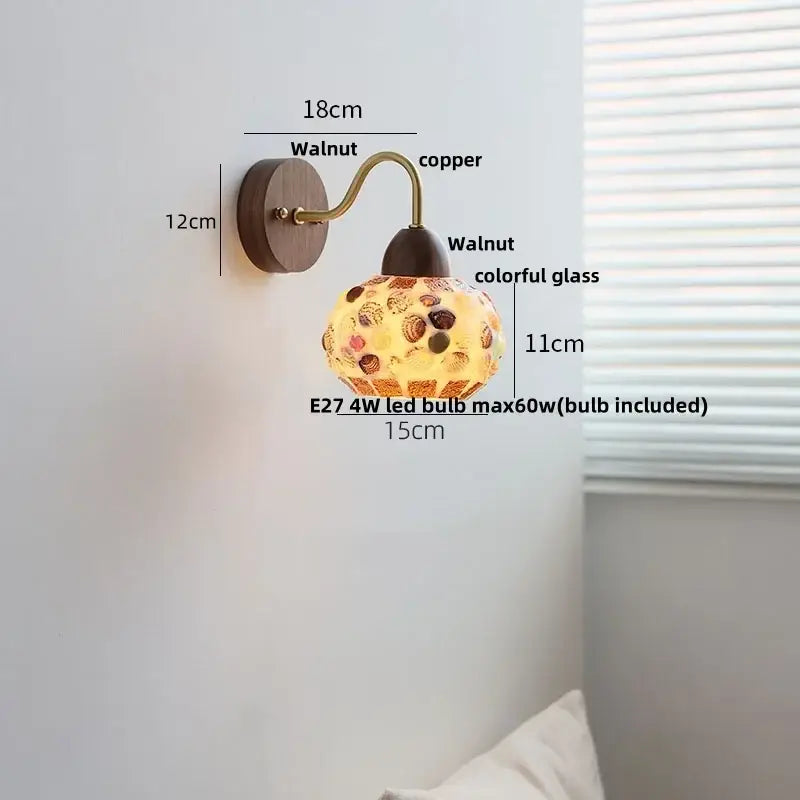 A decorbites led tiffany style wall sconce with a walnut base and colorful mosaic glass globe for stair lighting