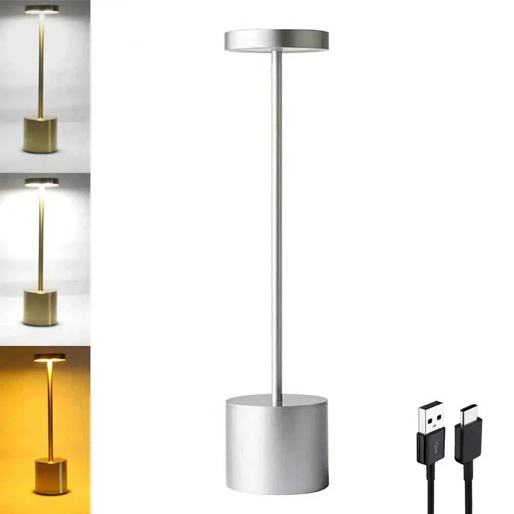 A sleek silver DecorBites LED touch dimming table lamp with adjustable head emits warm or cool white light