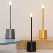 Three decorbites led touch table lamps with cylindrical bases in matte gray black and brushed gold finishes for home use