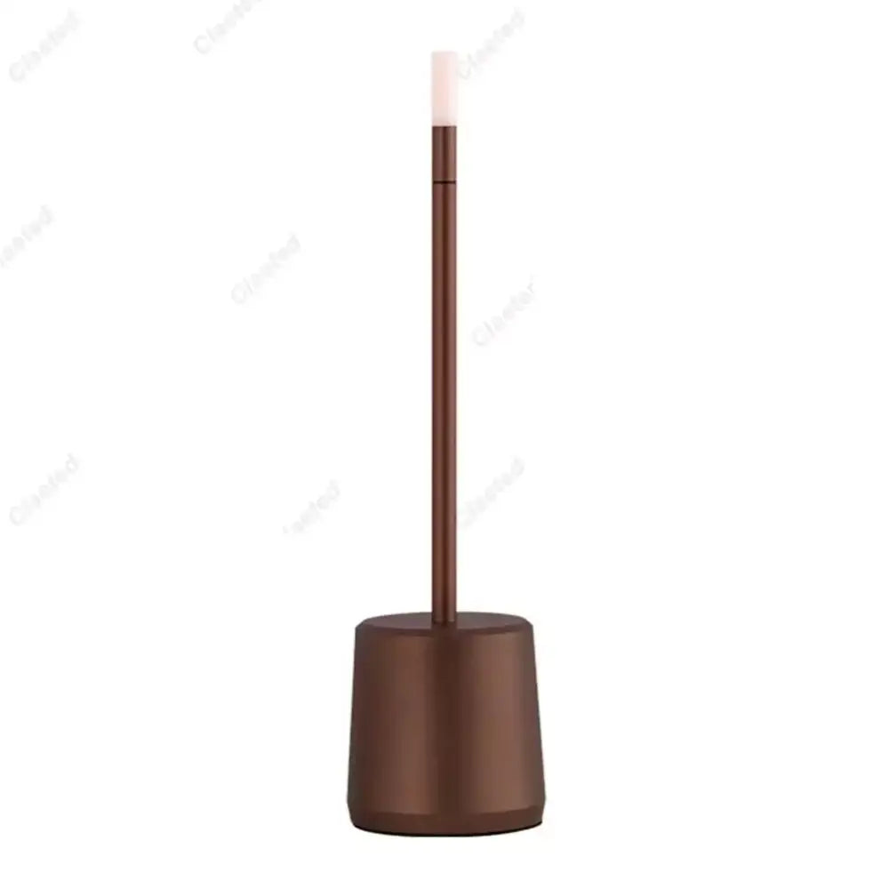 Bronze-finished toilet brush stand with sleek cylindrical base and handle shown with decorbites led touch table lamp