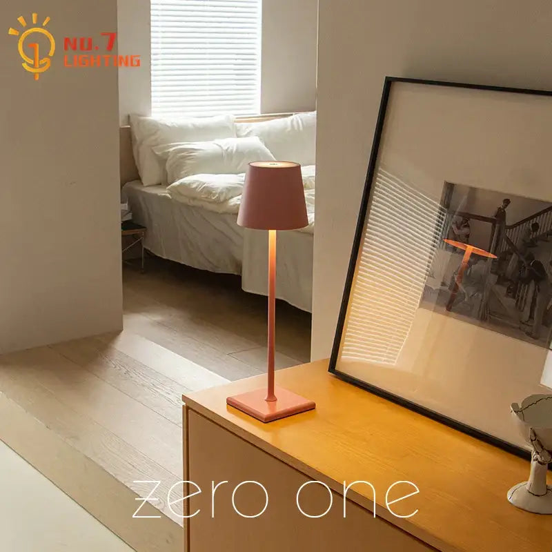 A decorbites led touch table lamp with matte peach cylindrical shade and square base featuring usb charging