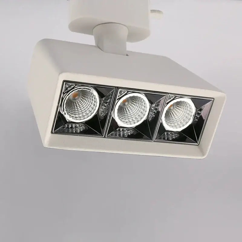 White rectangular decorbites led track light with three black geometric led bulbs for commercial and home use