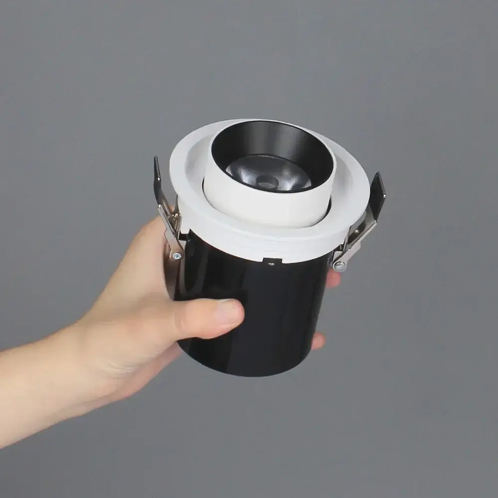 Black and white decorbites led transformer downlight with metallic mounting clips and rotatable recessed spotlight cob chip