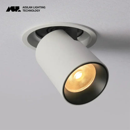 White cylindrical decorbites led transformer downlight with matte finish and black reflector emitting warm light