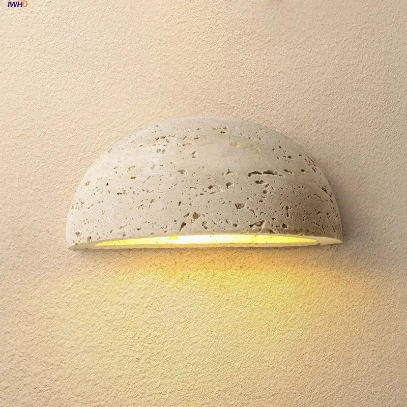 DecorBites led travertine wall light with a textured concrete half-sphere and warm yellow ambiance for porch and study