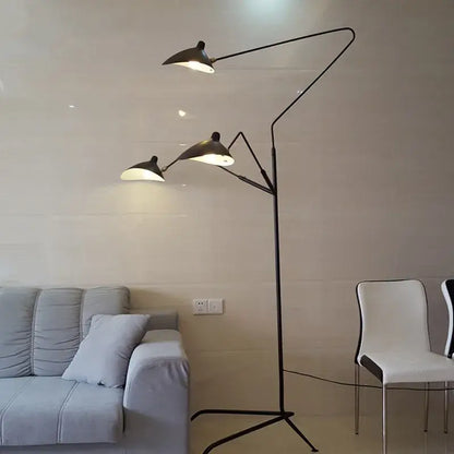 Black metal floor lamp with three articulated arms and angled shield-shaped shades decorbites led tripod floor lamp