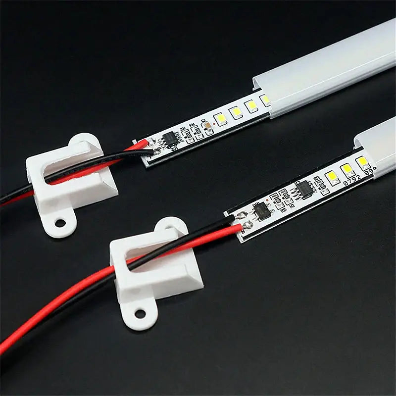White decorbites led tube lamp showing circuit board and red black wires in translucent plastic casing for cabinet lighting