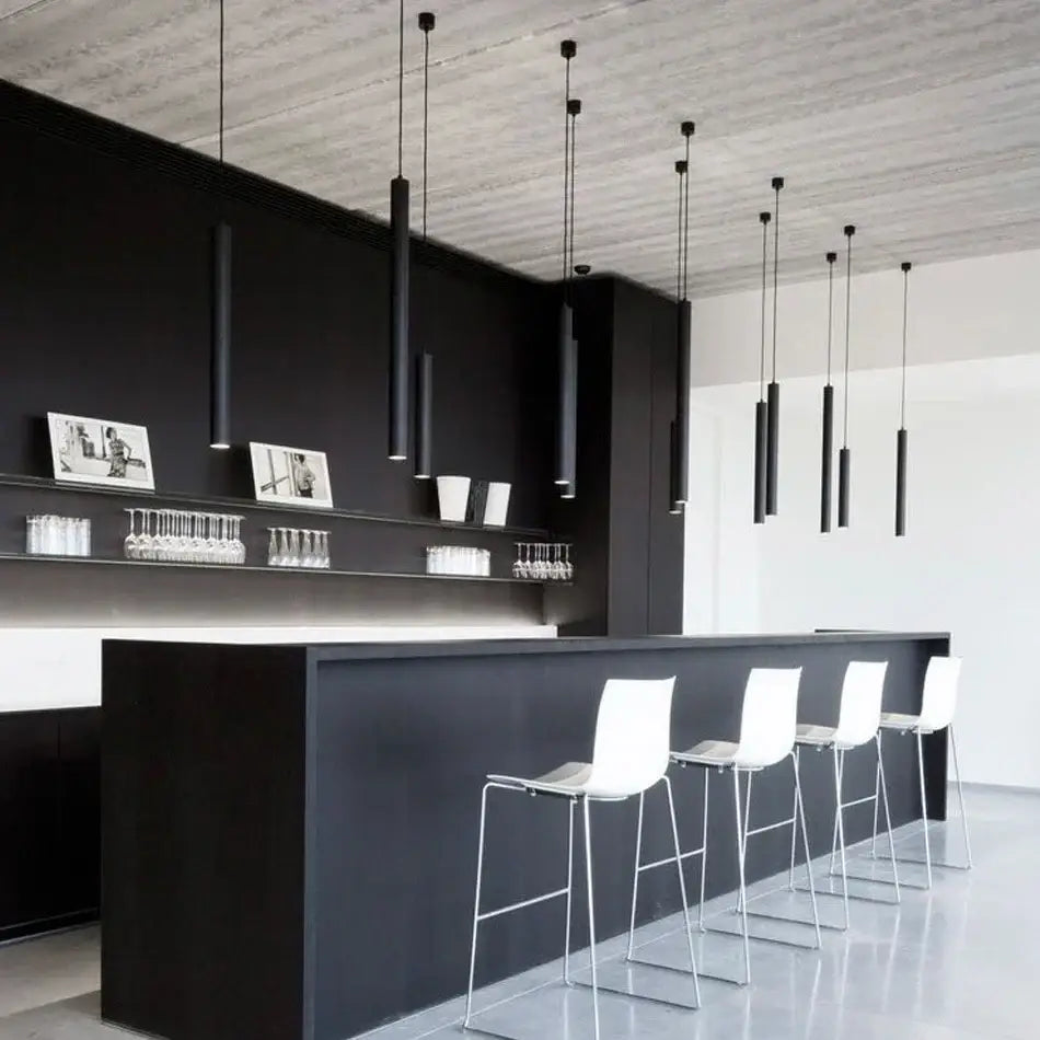 Black minimalist bar featuring a decorbites led tube pendant light 5w with sleek white stools for modern kitchen dining decor
