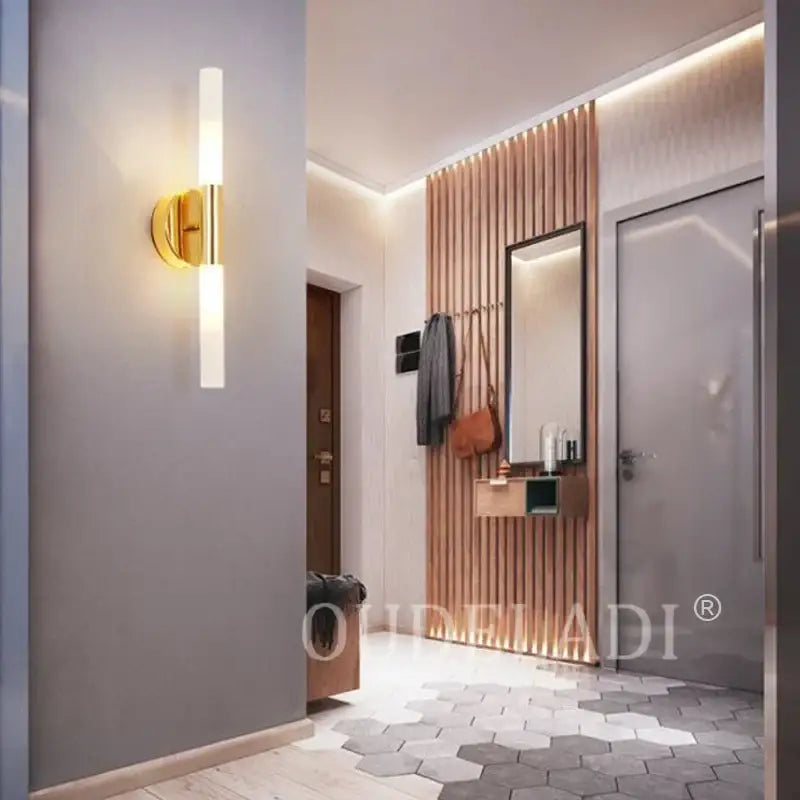 Gold-toned decorbites led tube wall light with sleek cylindrical frosted glass shade for modern indoor lighting