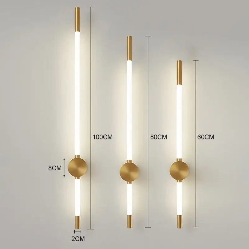 Gold-toned decorbites led tube wall lights with sleek cylindrical led tubes and minimalist circular black gold sconces