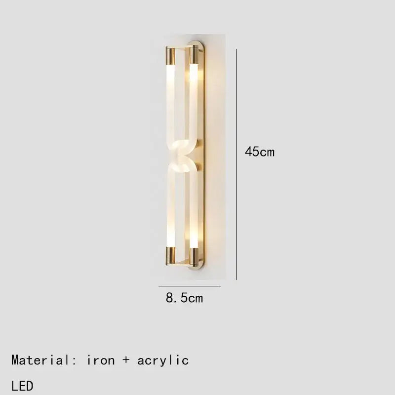 Modern gold-toned decorbites led tube wall sconce with two vertical acrylic panels framed in black iron, 45cm tall and 8.5cm wide