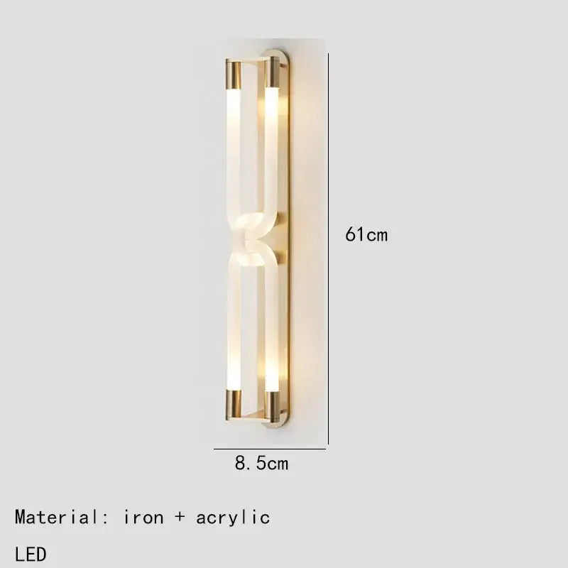 Modern gold-toned decorbites led tube wall sconce with two acrylic light tubes framed by black iron metal
