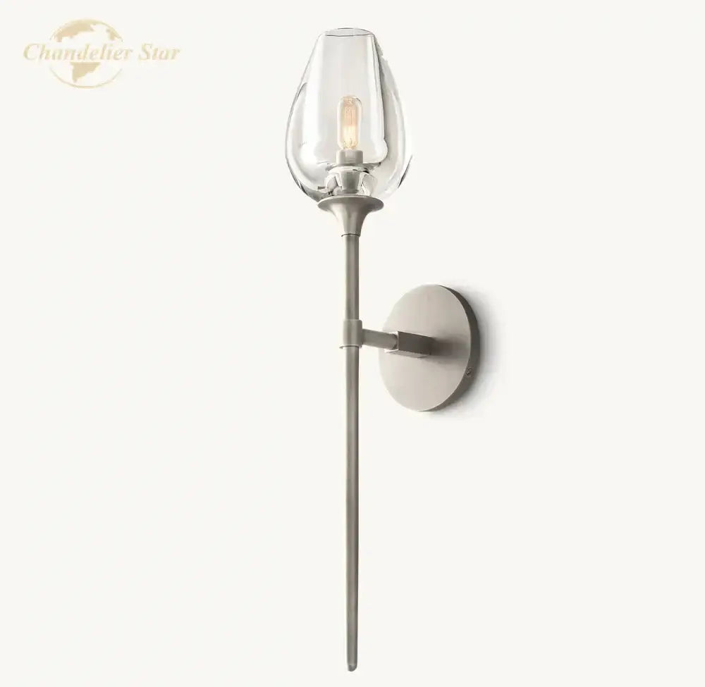 A sleek modern DecorBites LED tulip wall sconce with clear led tulip glass shade and brushed metal finish for indoor use