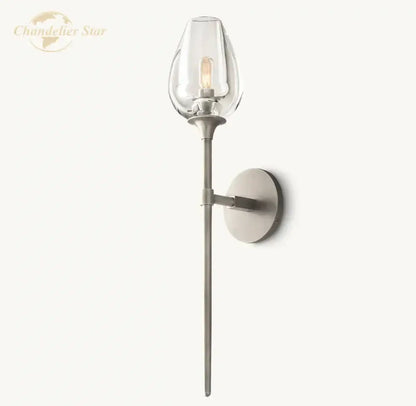 A sleek modern DecorBites LED tulip wall sconce with clear led tulip glass shade and brushed metal finish for indoor use