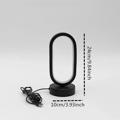 Black oval-shaped DecorBites led bedside decorative lamp with usb charging cable for bedroom bedside lighting