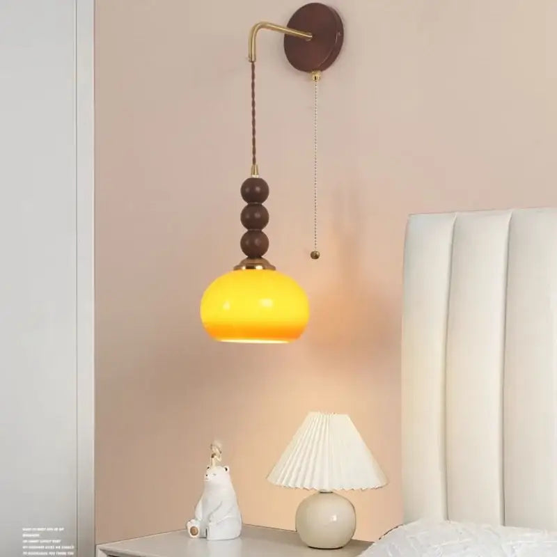 Warm yellow glass pendant lamp with brass accents and dark wooden beads for decorbites led wall orange glass pendant light bedroom brass accent