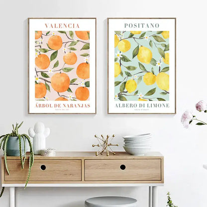 Two framed vintage plant wall art prints featuring lemon flower and valencia citrus trees in watercolor style