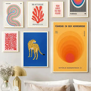 A vibrant yellow wall art with concentric orange and red circles featuring german text on an abstract canvas block design