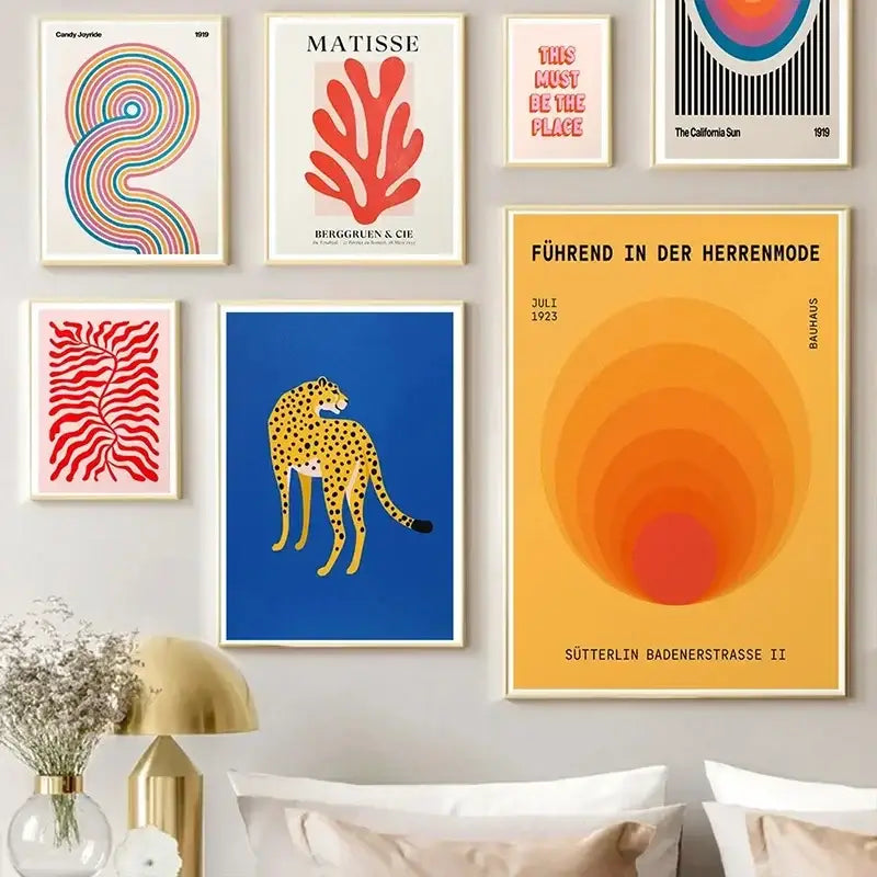 A vibrant yellow wall art with concentric orange and red circles featuring german text on an abstract canvas block design