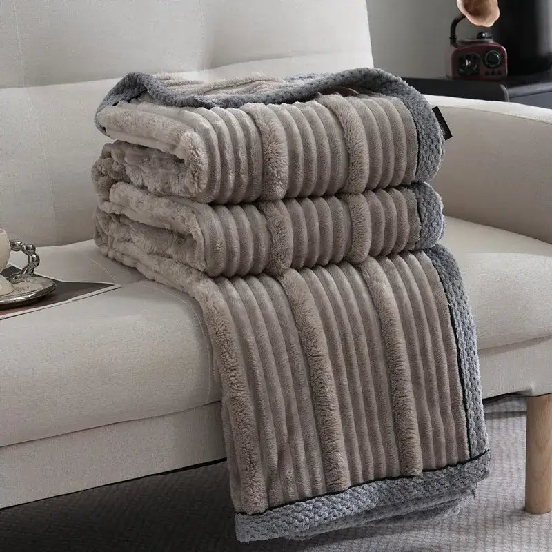 Stacked gray plush throw blanket with ribbed texture and knitted border from Decorbites light luxury sofa blanket collection