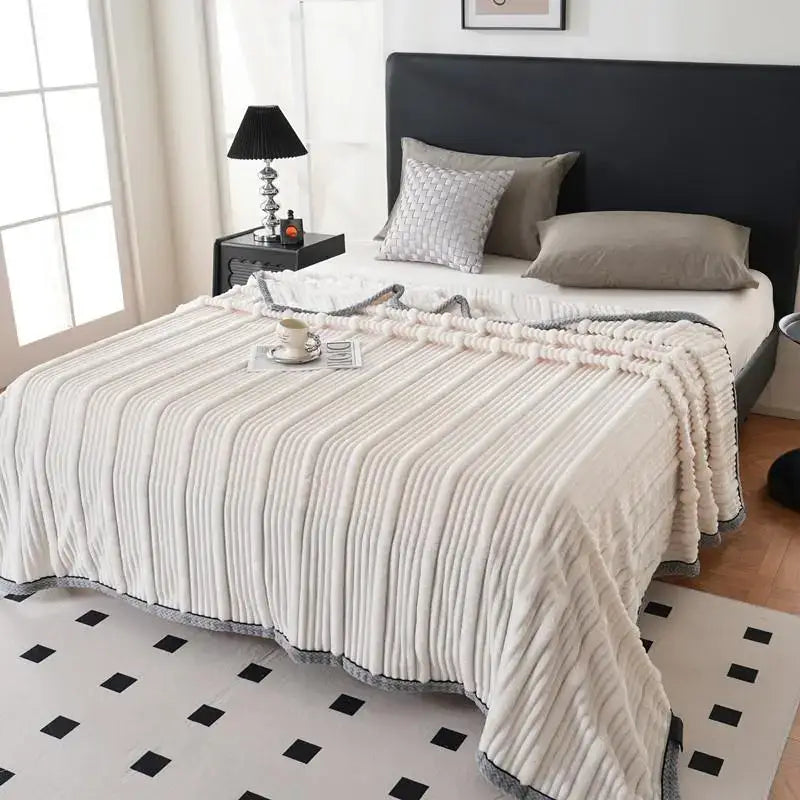 Cream-colored plush ribbed throw blanket with gray trim by Decorbites light luxury for a luxury sofa blanket use