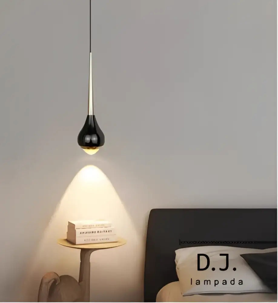 Black teardrop pendant light with metallic stem and warm bulb in decorbites light luxury meteor chandelier for living room