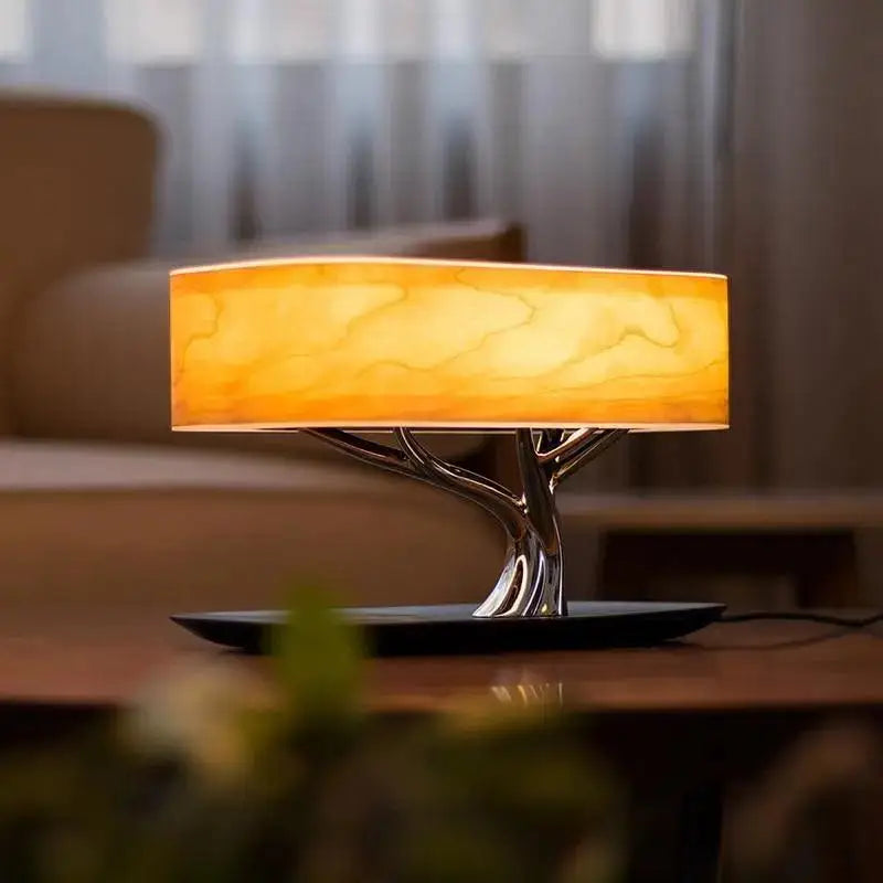 Decorbites™ life table lamp with warm amber acrylic shade and sleek metallic tree base on black circular stand