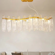 Gold-toned linear island lamp with 8 clear k9 crystal teardrop pendants for living room lighting