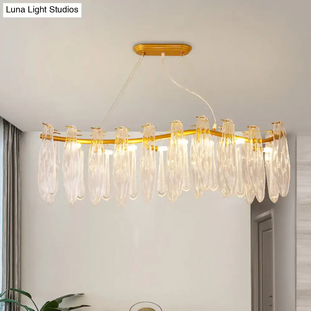 Elegant gold-toned DecorBites linear island lamp with 8 clear K9 crystal teardrop pendants for living room lighting