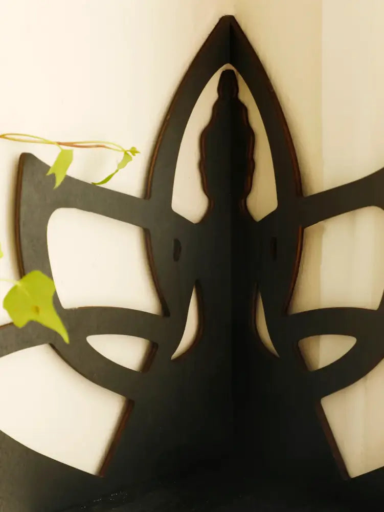 Black wooden lotus floating wall shelf by DecorBites™ featuring stylized lotus flower cut-out patterns