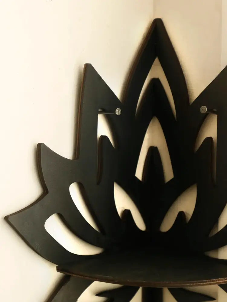 DecorBites™ lotus floating wall shelf in black laser-cut wood with flat open design and visible top screws