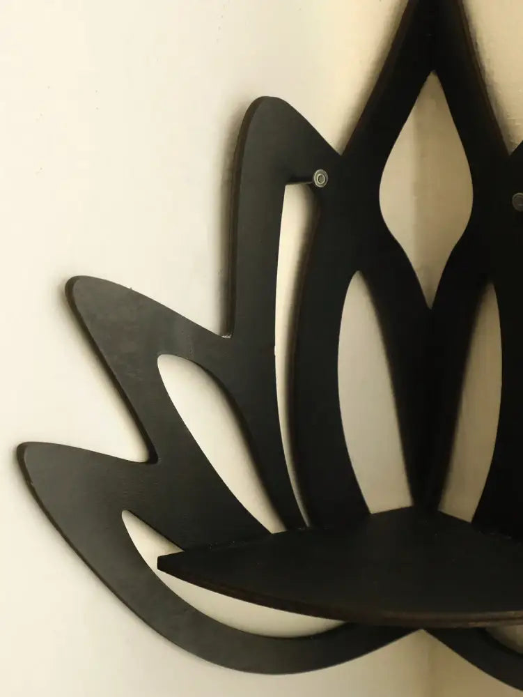 Decorbites™ lotus floating wall shelf in black wood with curved base and cut-out petal design for multi-style decor
