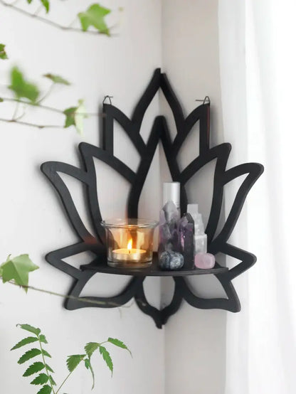 Black metal lotus floating wall shelf with central glass candle holder and crystal decor for multi-style home decor
