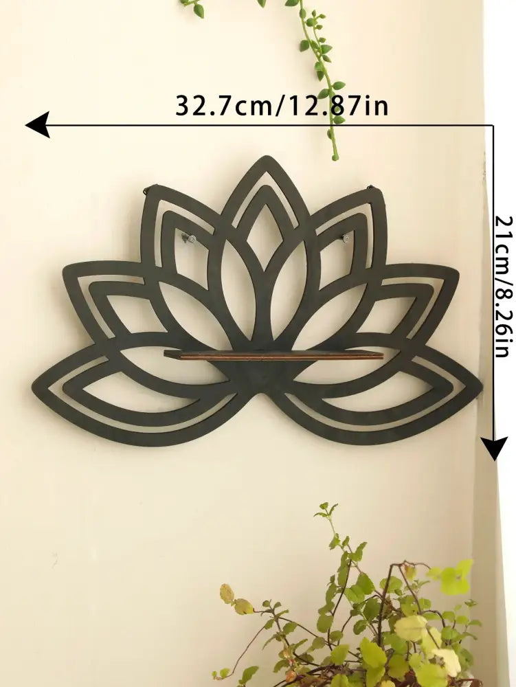 Black metal lotus floating wall shelf with a horizontal wooden stick for multi-style home decor by DecorBites™