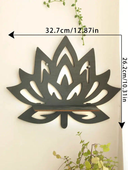 Dark gray metal lotus floating wall shelf with sleek cut-out design and integrated wooden support bar by decorbites