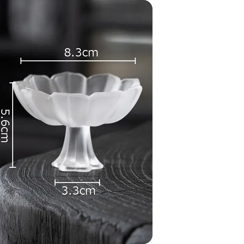 A set of 2 decorbites lotus flower glass tea cups in translucent white with delicate petal design and slender stem