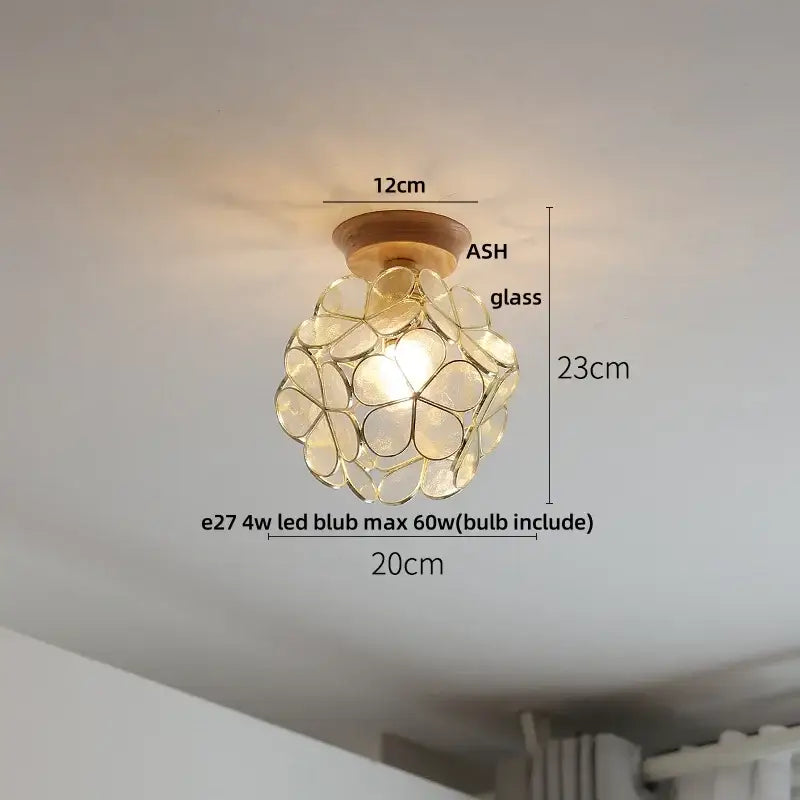 Decorbites lotus glass led ceiling light with a warm glow, spherical glass shade, and ash wood base in modern nordic style