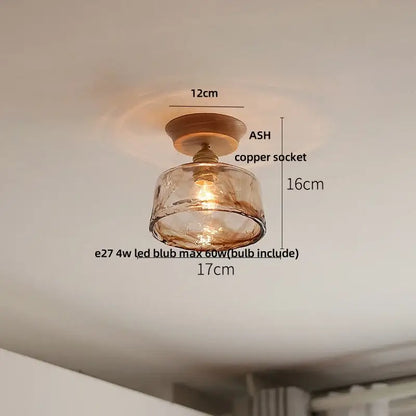 DecorBites lotus glass led ceiling light with warm amber glass pendant, copper socket, and wooden base in modern Nordic style