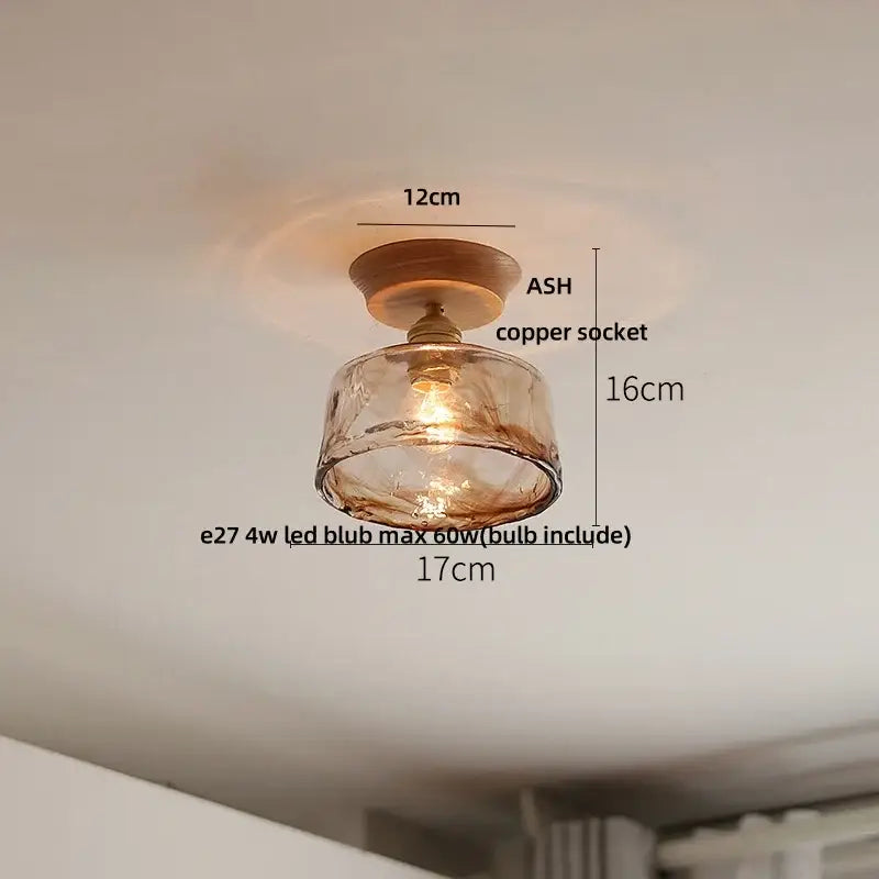 DecorBites lotus glass led ceiling light with warm amber glass pendant, copper socket, and wooden base in modern Nordic style