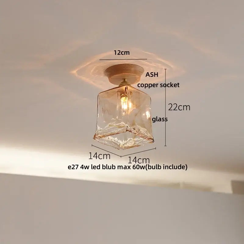 A warm-toned hand-blown decorbites lotus glass led ceiling light with copper socket and included led bulb