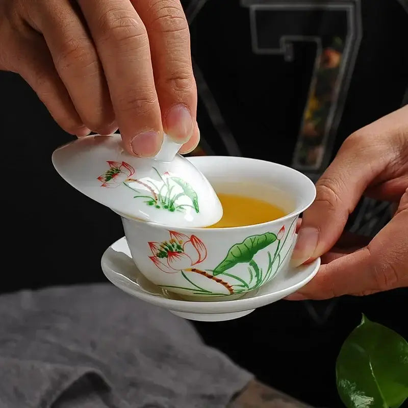 White porcelain gaiwan tea set with hand-drawn red and green lotus flowers by DecorBites lotus for puer tea brewing