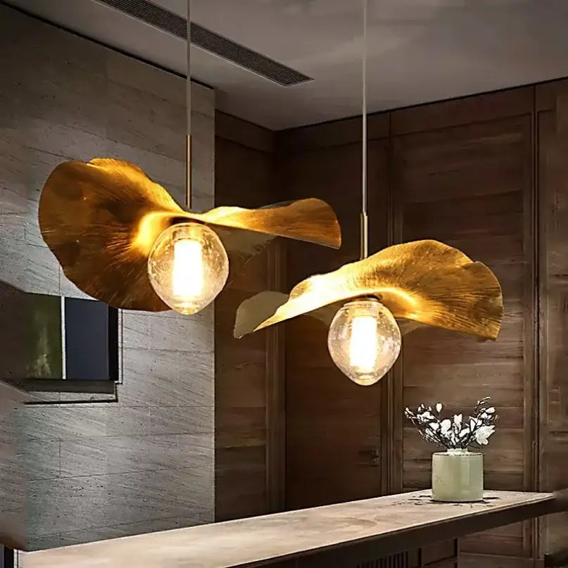 Golden leaf-shaped pendant lamp with warm glow clear glass bulbs decorbites lotus leaf brass for minimalist rooms