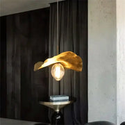 Gold leaf pendant lamp with warm glow and exposed bulb decorbites lotus leaf brass pendant lamp for minimalist rooms
