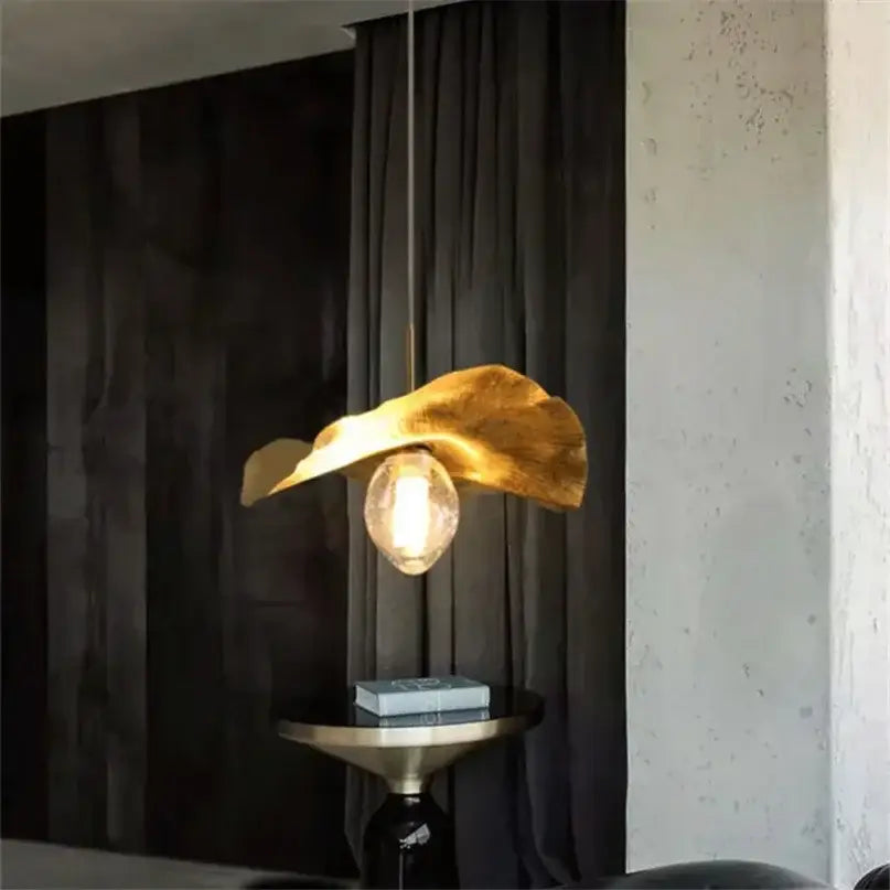 Gold leaf pendant lamp with warm glow and exposed bulb decorbites lotus leaf brass pendant lamp for minimalist rooms