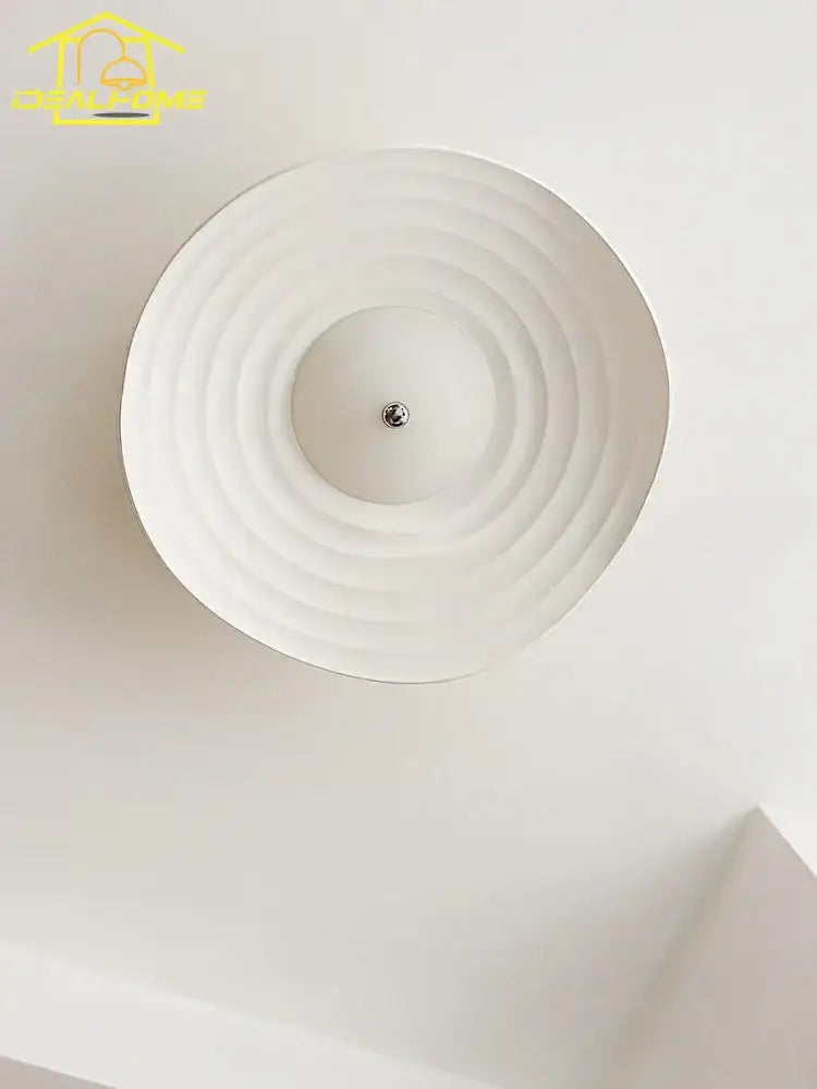 White decorbites lotus leaf ceiling light with concentric ridged resin design and central metallic LED fixture for home decor