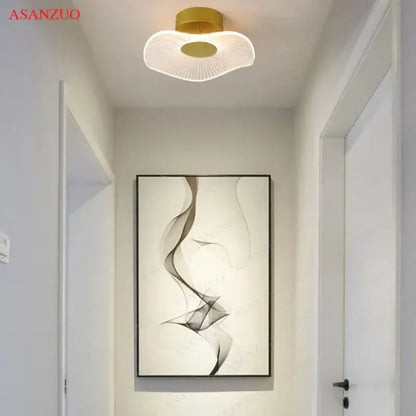 Gold-toned decorbites lotus leaf ceiling light with translucent fan-shaped diffuser and radial led illumination for indoor use